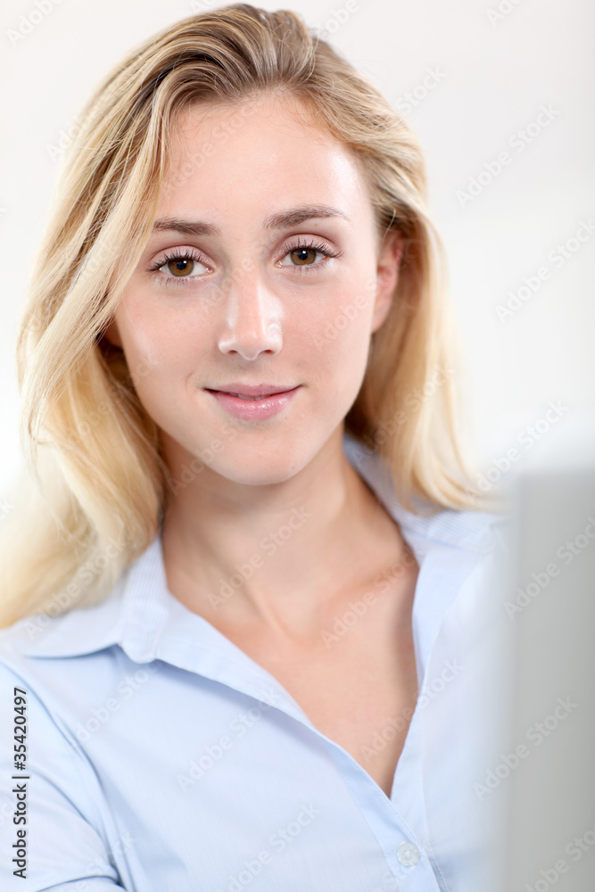 Beautiful woman in office working on laptop computer Beautiful woman in office working on laptop computer