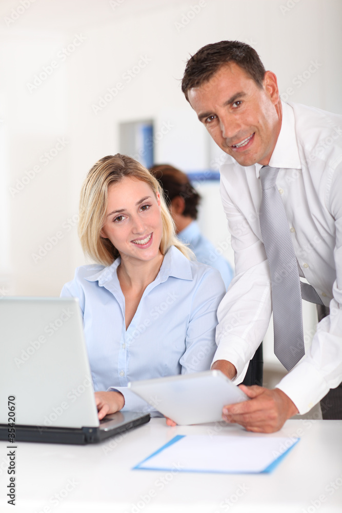 Office workers meeting with electronic tablet Office workers meeting with electronic tablet