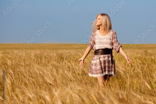 woman walking on wheat field
