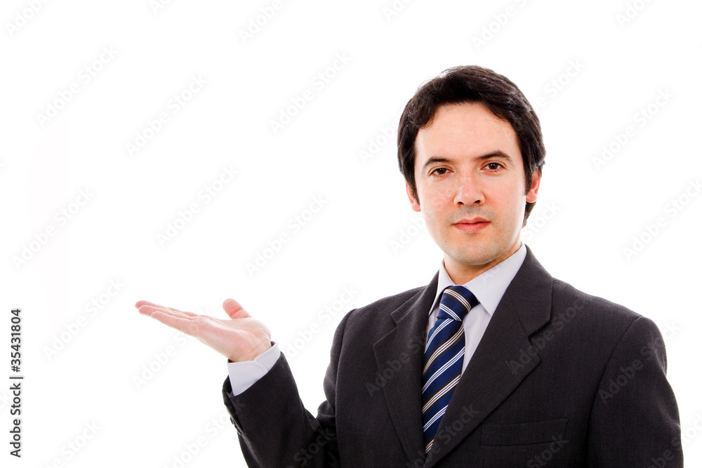 Young businessman with arm out in a welcoming gesture , isolated Young businessman with arm out in a welcoming gesture , isolated