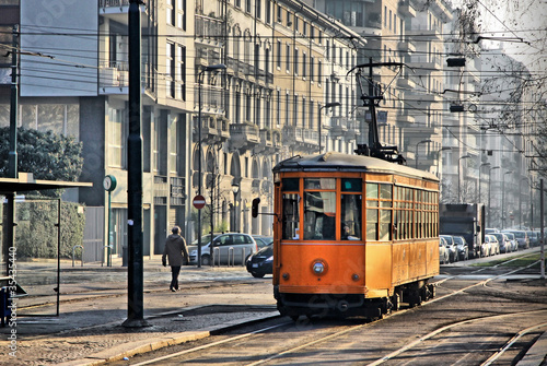 Old vintage orange tram on the street of Milan, Italy #35435440