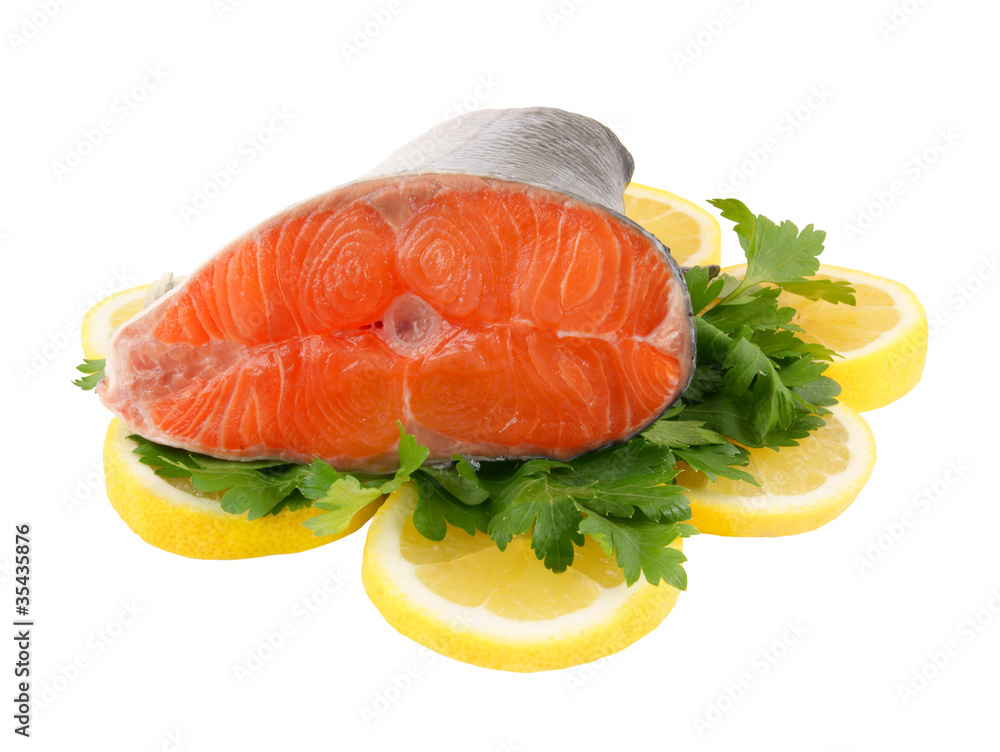 Salmon steak with parsley and lemon isolated