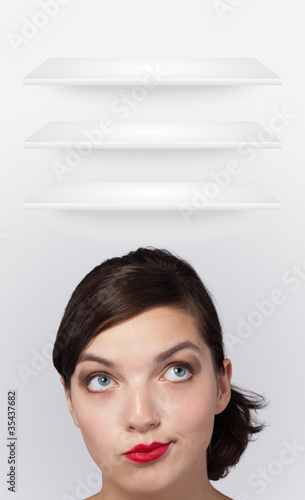 Young girl looking at white copyspace