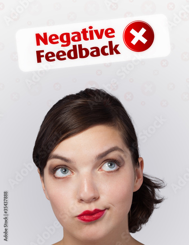 Young girl looking at positive negative signs