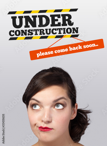 Young girl looking at contruction icons