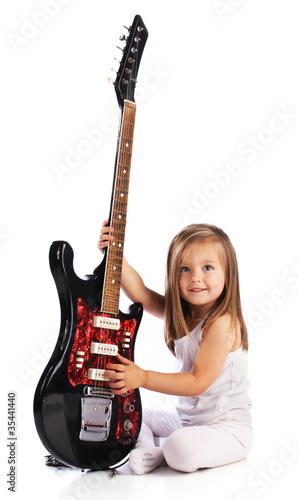 Small child hold red acoustic guitar. Music concept. Isolated