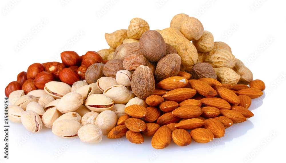 almonds, nutmeg, peanuts and pistachios isolated on white almonds, nutmeg, peanuts and pistachios isolated on white
