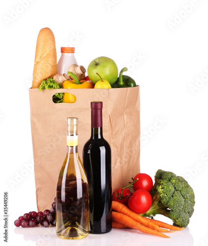 Fototapeta Naklejka Na Ścianę i Meble -  vegetables and wine in a paper bag isolated on white