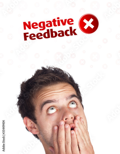 Young head looking at positive negative signs photo