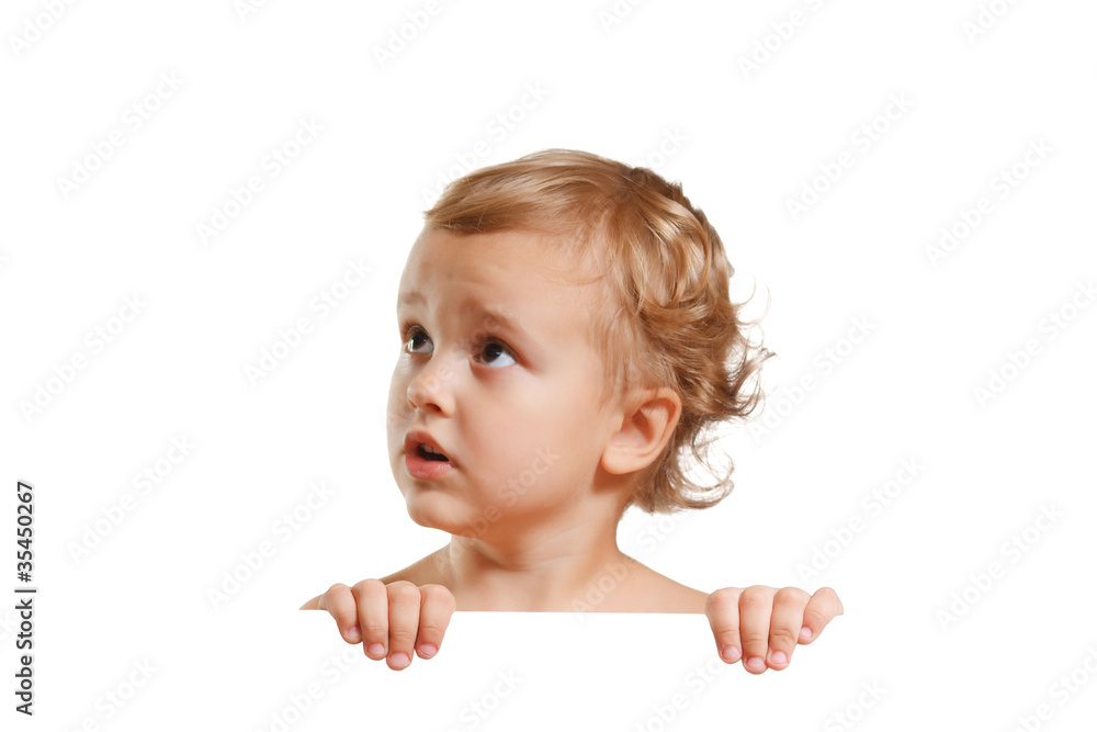Little cute boy holding a white blank