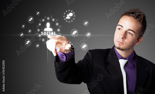 Businessman pressing modern social type of icons