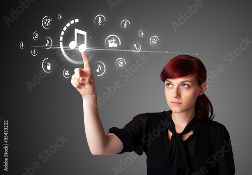 Businesswoman pressing virtual media type of buttons