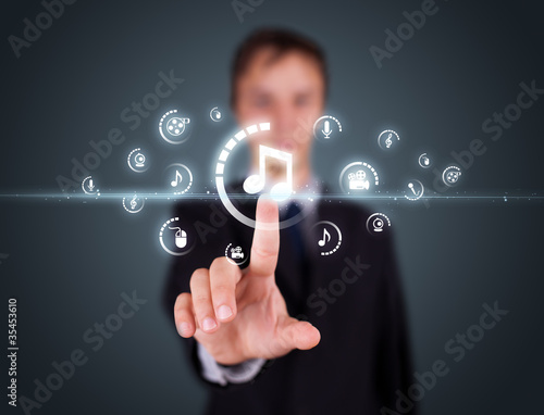 Businessman pressing virtual media type of buttons