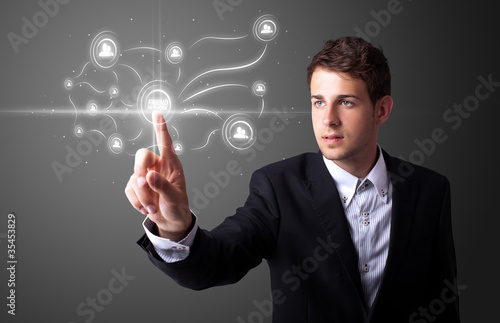 Businessman pressing modern social type of icons