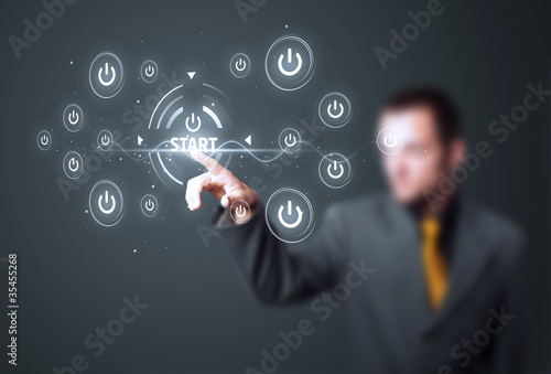 Businessman pressing simple type of start buttons