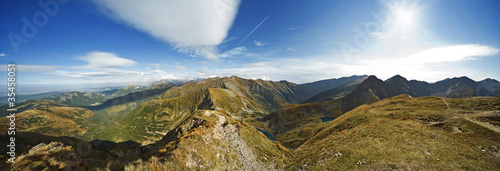 Polish mountain and small lake over the blue sky