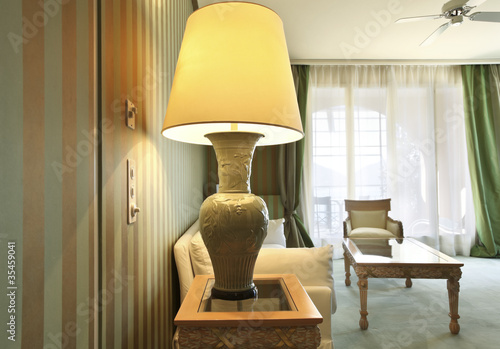 interior luxury apartment, comfortable suit, closeup table lamp