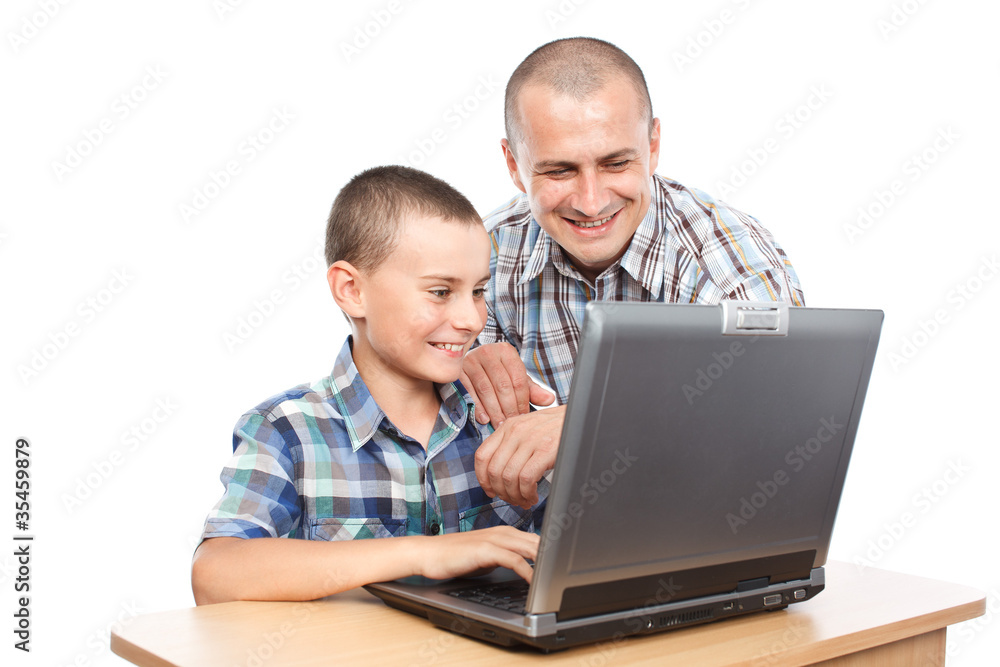 Father and son at the computer Father and son at the computer