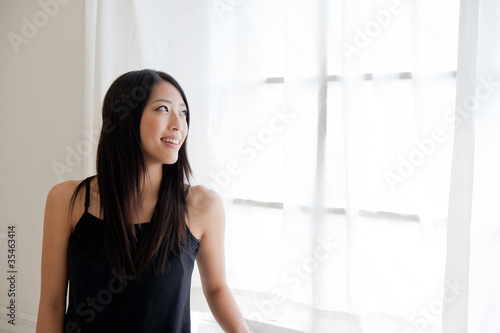 attractive asian woman relaxing in the room