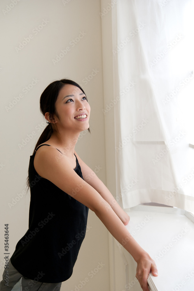 attractive asian woman relaxing in the room attractive asian woman relaxing in the room