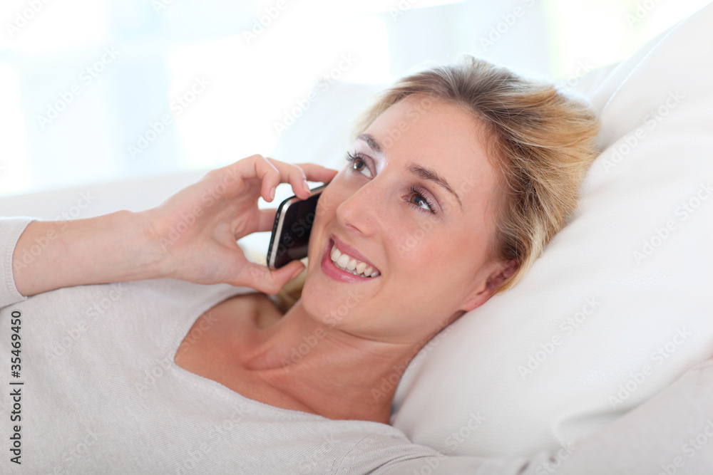 Portrait of beautiful young woman talking on mobile phone Portrait of beautiful young woman talking on mobile phone