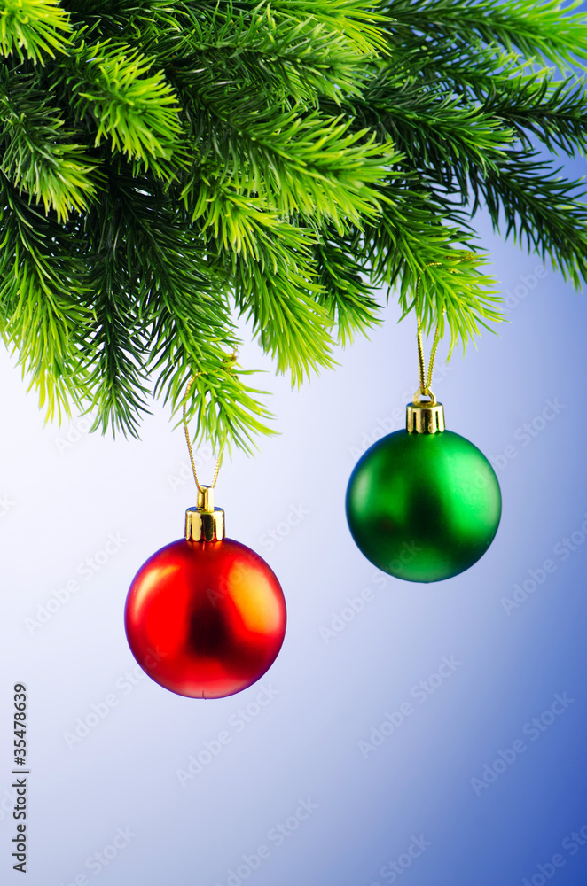Baubles on christmas tree in celebration concept Baubles on christmas tree in celebration concept
