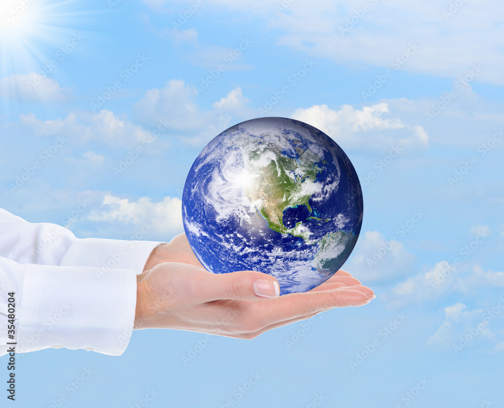 Planet Earth in the female hand Planet Earth in the female hand