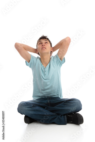 Billede på lærred Thinking or troubled boy looking skyward