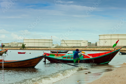 fishing boat with power plant background