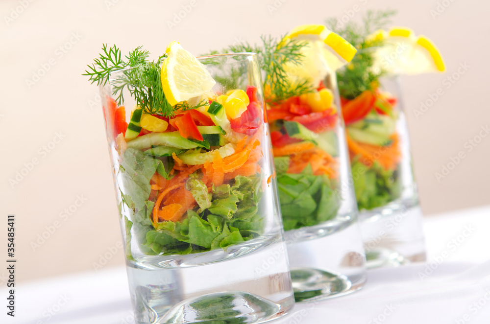 Delicious salad in the glasses Delicious salad in the glasses