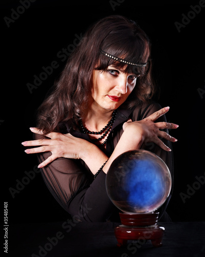 Young woman  with crystal ball.