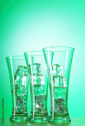 Glasses of water against gradient background