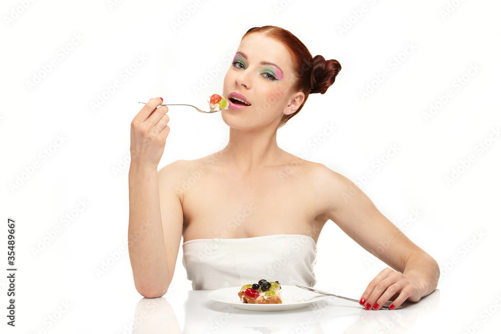 The beautiful young woman eat tasty cake The beautiful young woman eat tasty cake