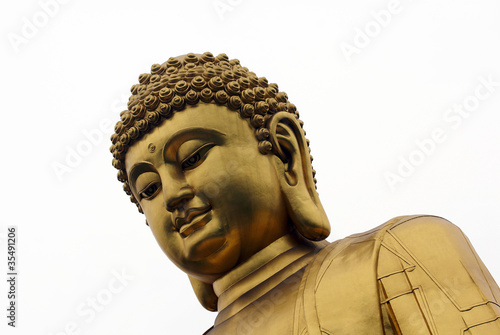 golden buddha statue closeup