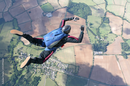 Fotografie, Obraz Skydiver in freefall high up in the air