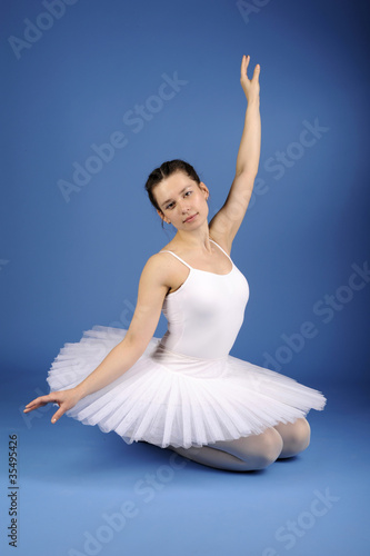 Ballet dancer posing in white tutu