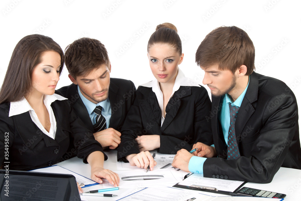 young business people sitting at desk working in team