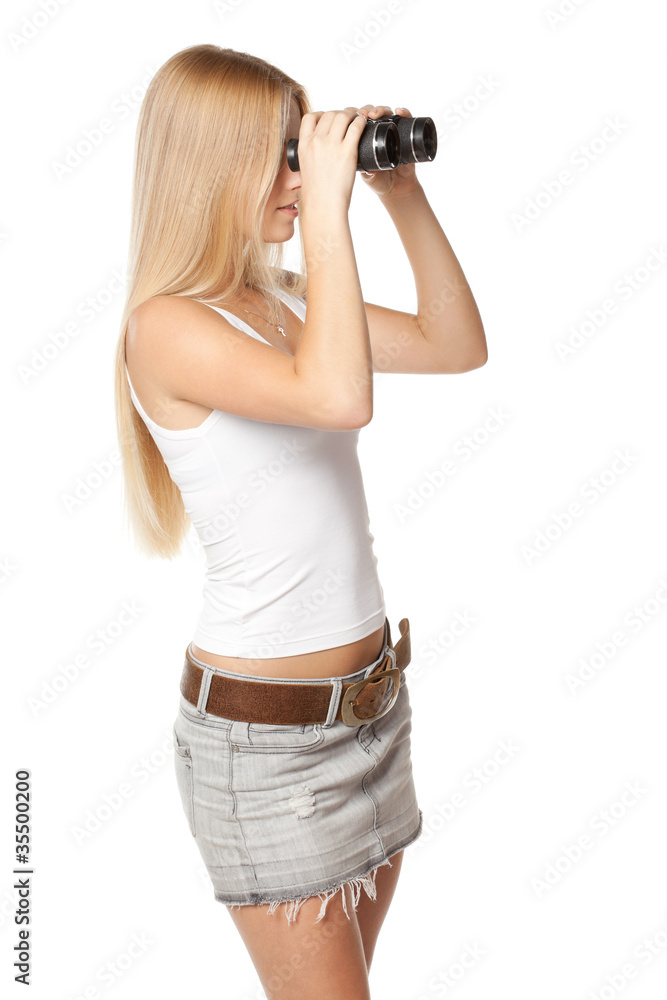 Side view of blond woman looking through binoculars Side view of blond woman looking through binoculars