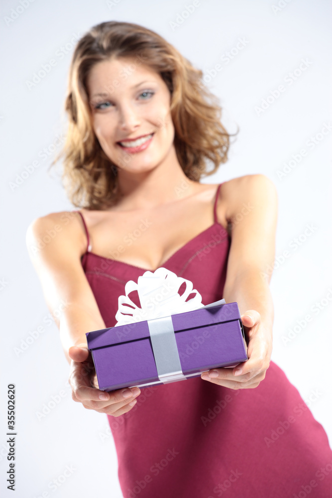 attractive happy young woman with gift pack, white background attractive happy young woman with gift pack, white background