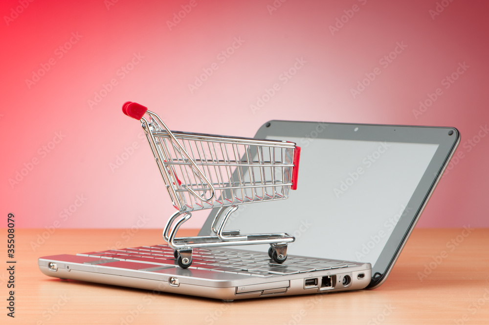 Internet online shopping concept with computer and cart Internet online shopping concept with computer and cart