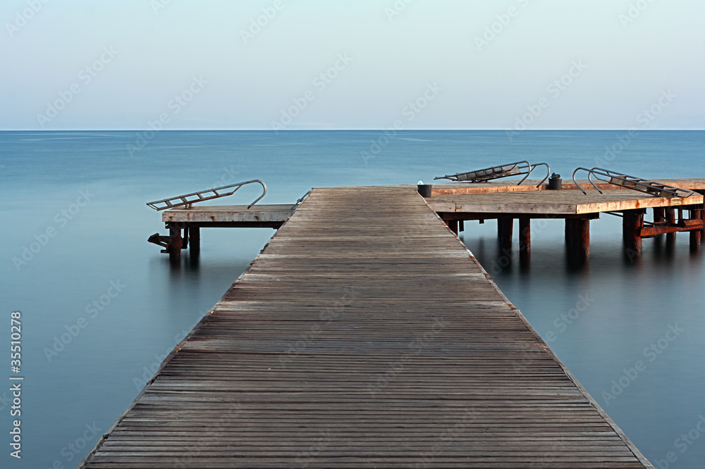 Long exposure on wooden pier at dawn
