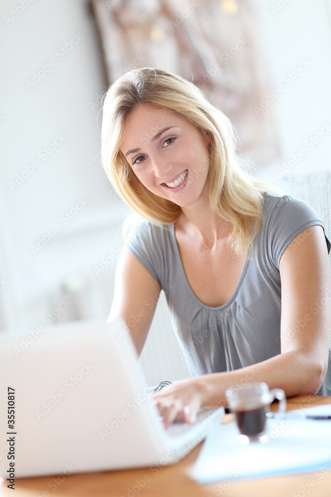 Woman working at home on laptop computer Woman working at home on laptop computer