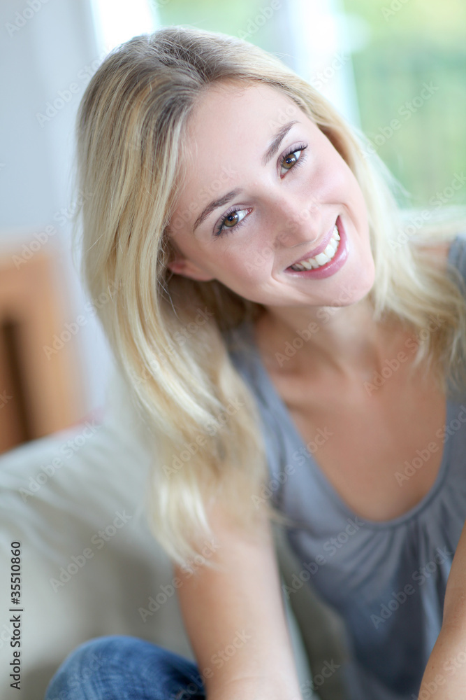 Beautiful smiling woman relaxing in sofa Beautiful smiling woman relaxing in sofa