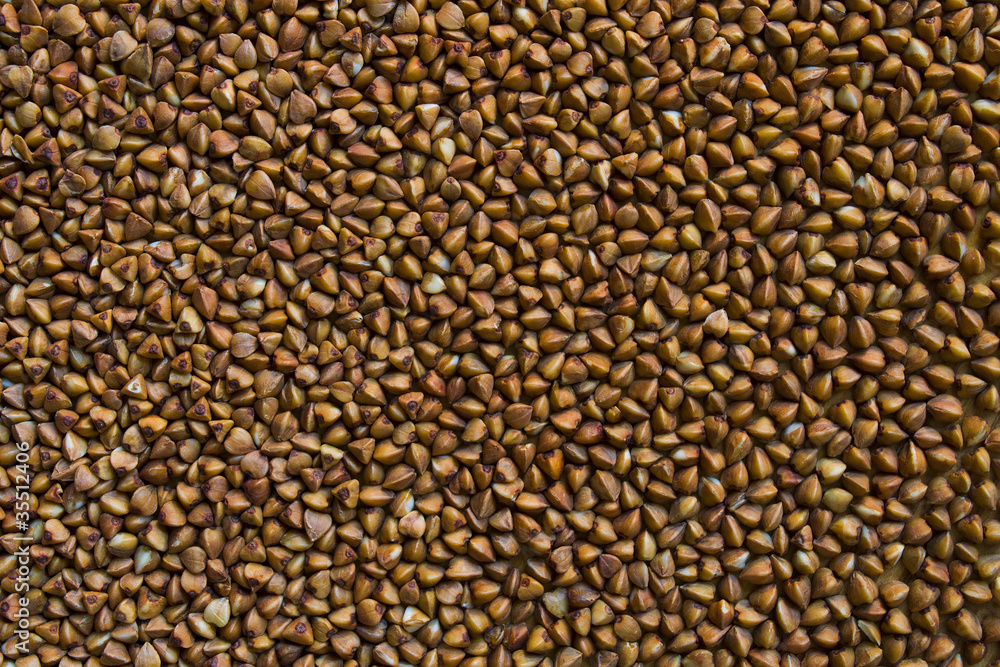 Buckwheat is on a wooden table evenly Buckwheat is on a wooden table evenly