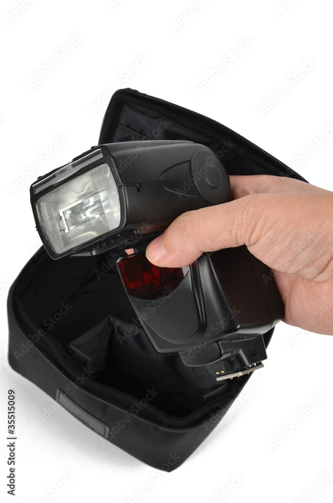 Fototapeta premium Camera flash and bag