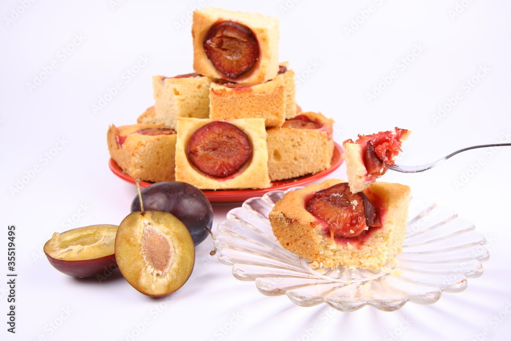 Plum Pie - a piece of it on a fork, some fresh plums Plum Pie - a piece of it on a fork, some fresh plums