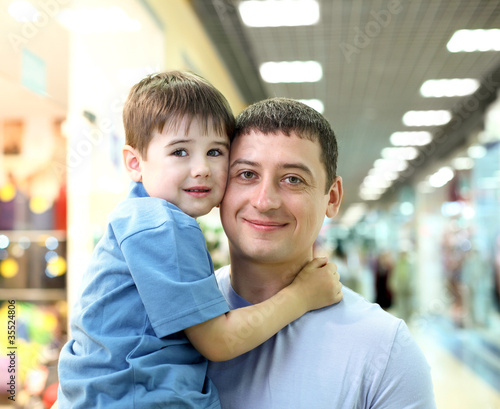 Father and child doing shopping