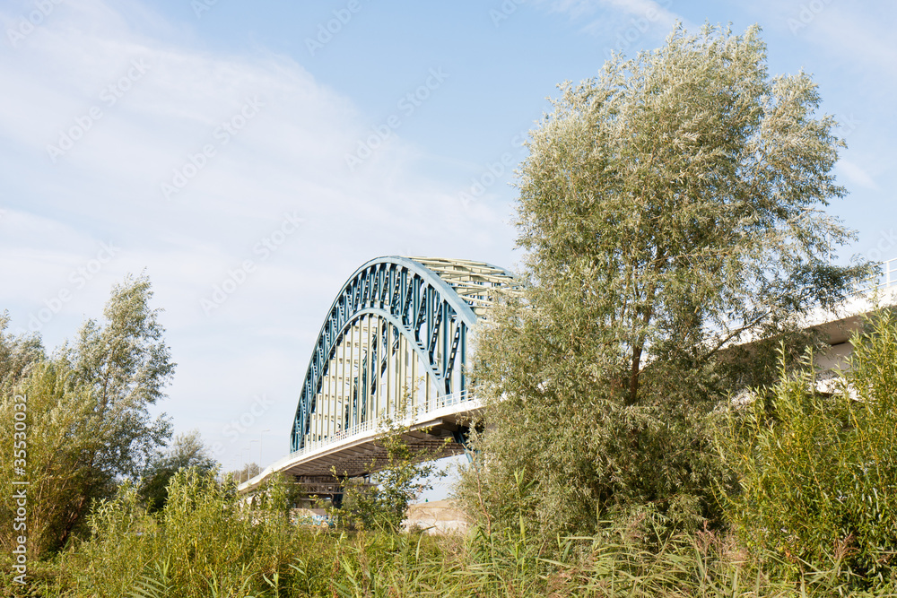 Old iron bridge crossing the river IJssel, the Netherlands Old iron bridge crossing the river IJssel, the Netherlands