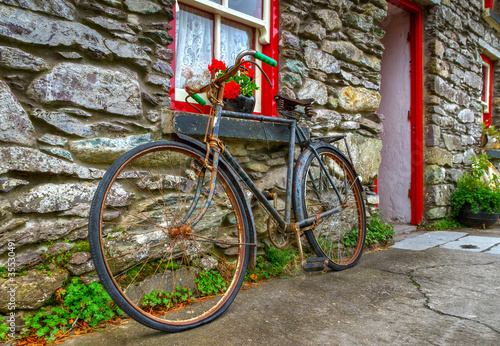 Old rusty bike at Irish cottage house #35530491