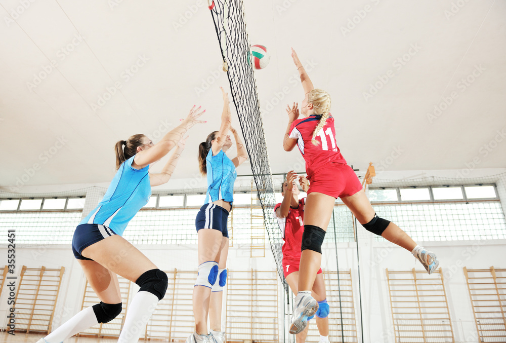 girls playing volleyball indoor game